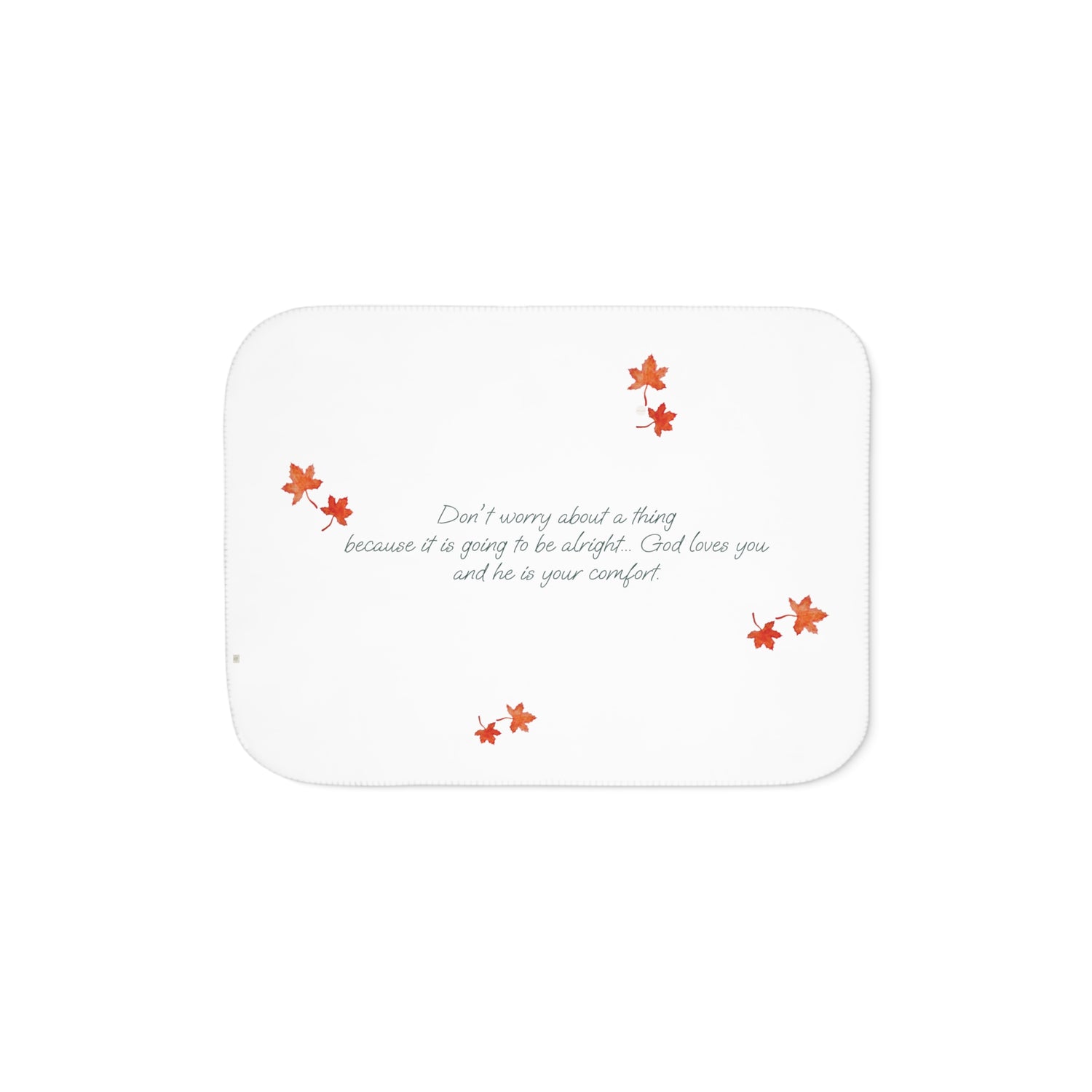 White side of blanket adorned with inspirational text, maple leaves pattern and eKuumeArt logo.