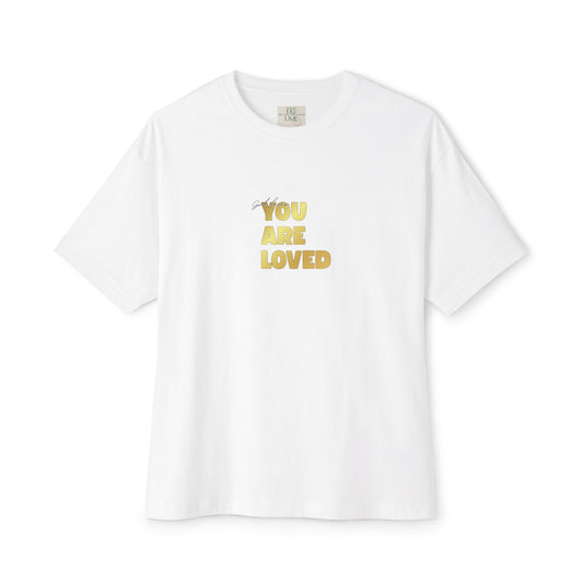 White t-shirt adorned with 'You Are Loved' text in gold and eKuumeArt neck label.