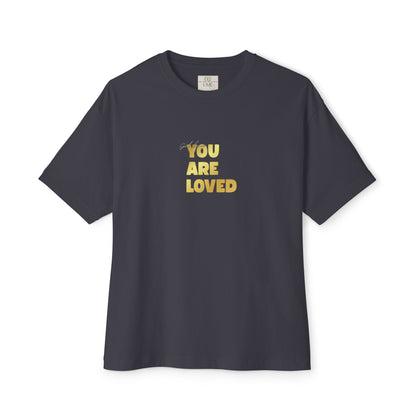 Dark Grey t-shirt adorned with 'You Are Loved' text in gold and eKuumeArt neck label.