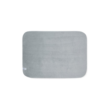 Grey sherpa side of two-coloured blanket.