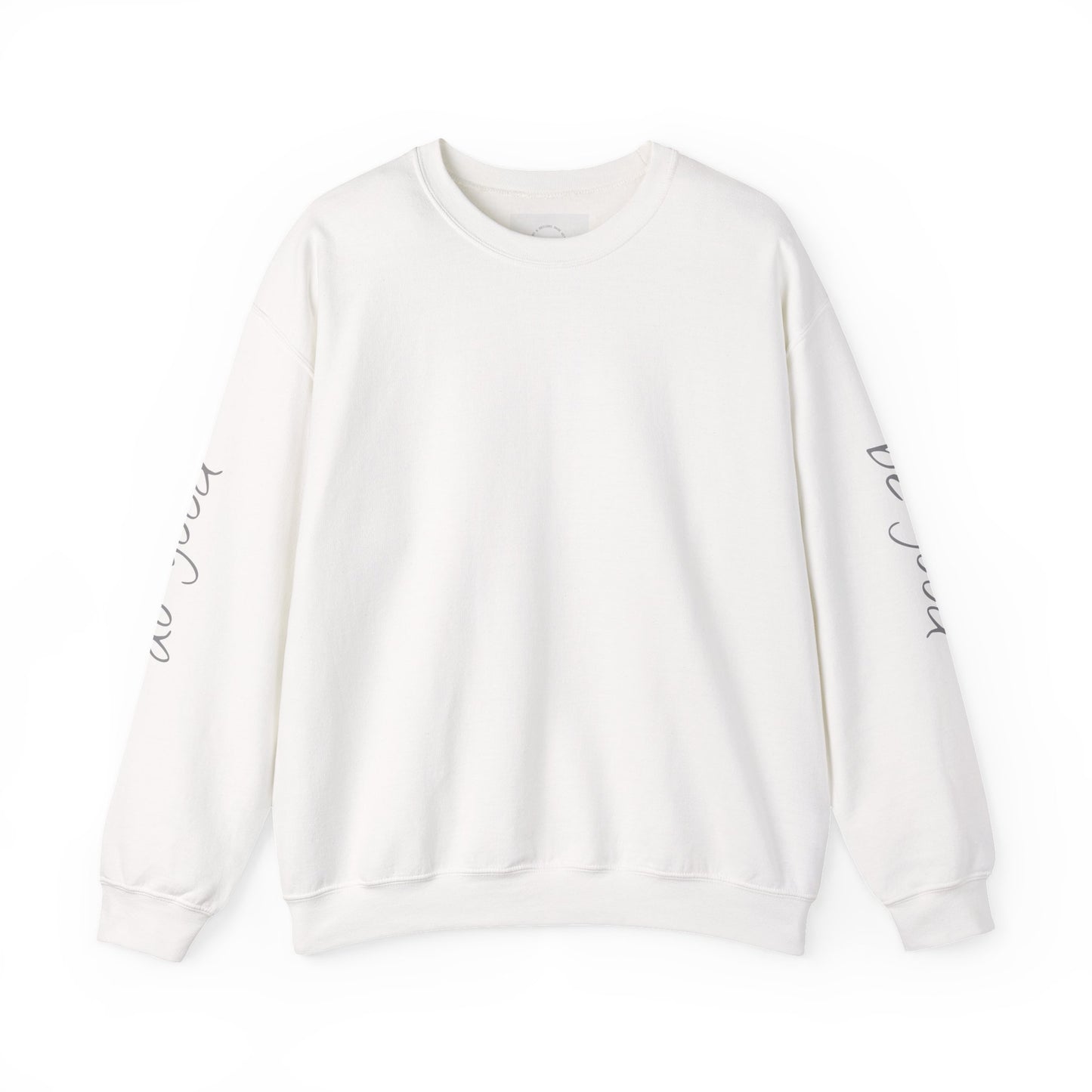 White crewneck sweatshirt with "be good, do good" text on sleeves