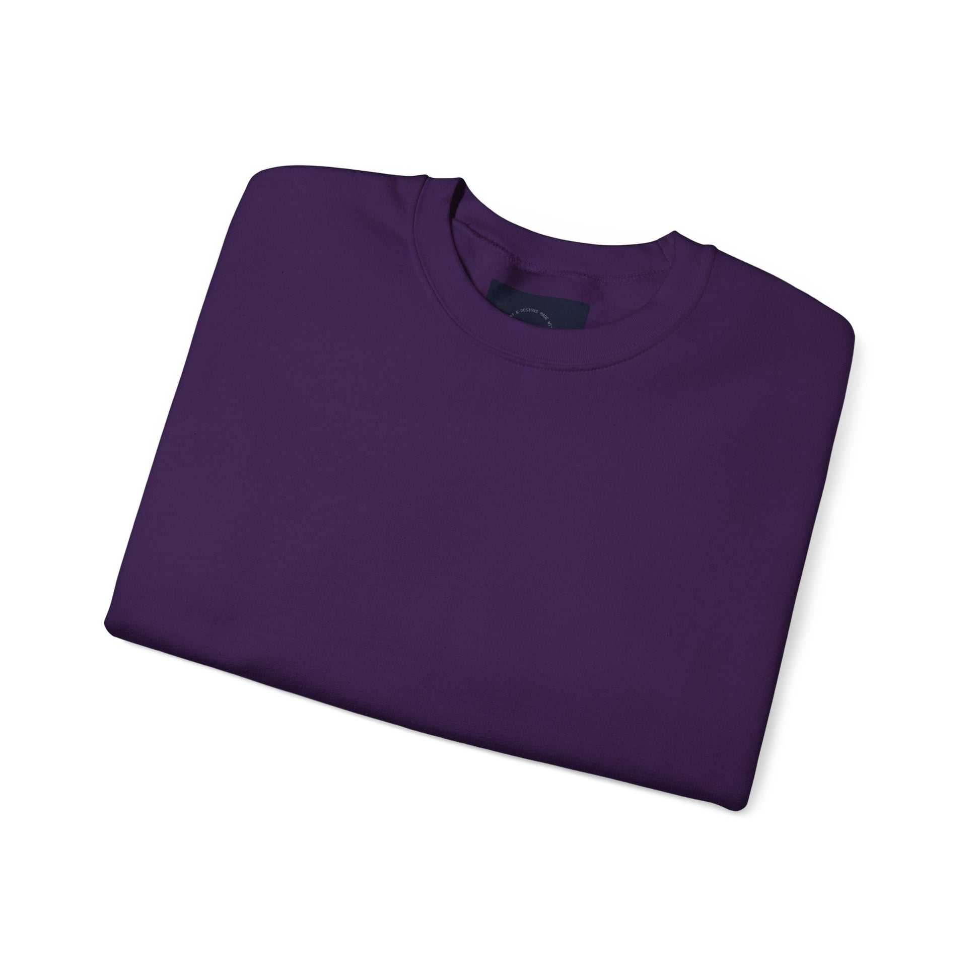 Purple crewneck sweatshirt, folded with a peek of eKuumeArt label