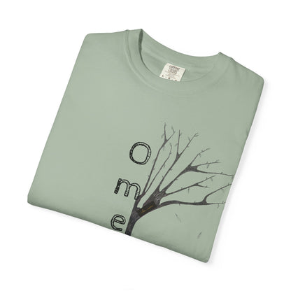 Bay tshirt, folded displaying hand-drawn tree with 'Omemma' text and eKuumeArt logo on chest.