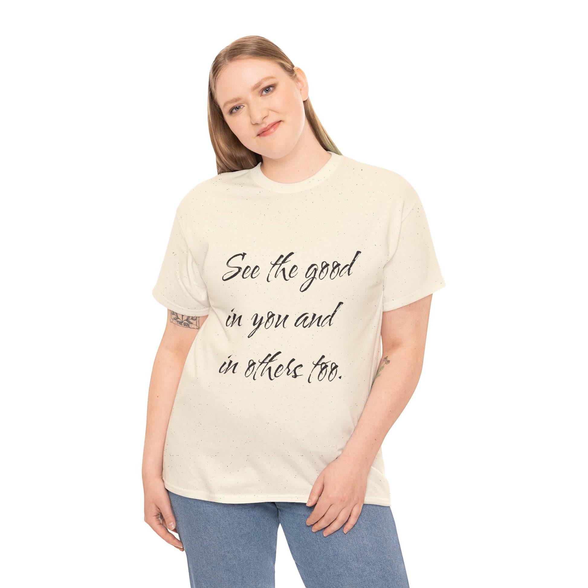Woman wearing a natural/beige heavy cotton t-shirt with ‘See the good…’ motivational quote text.
