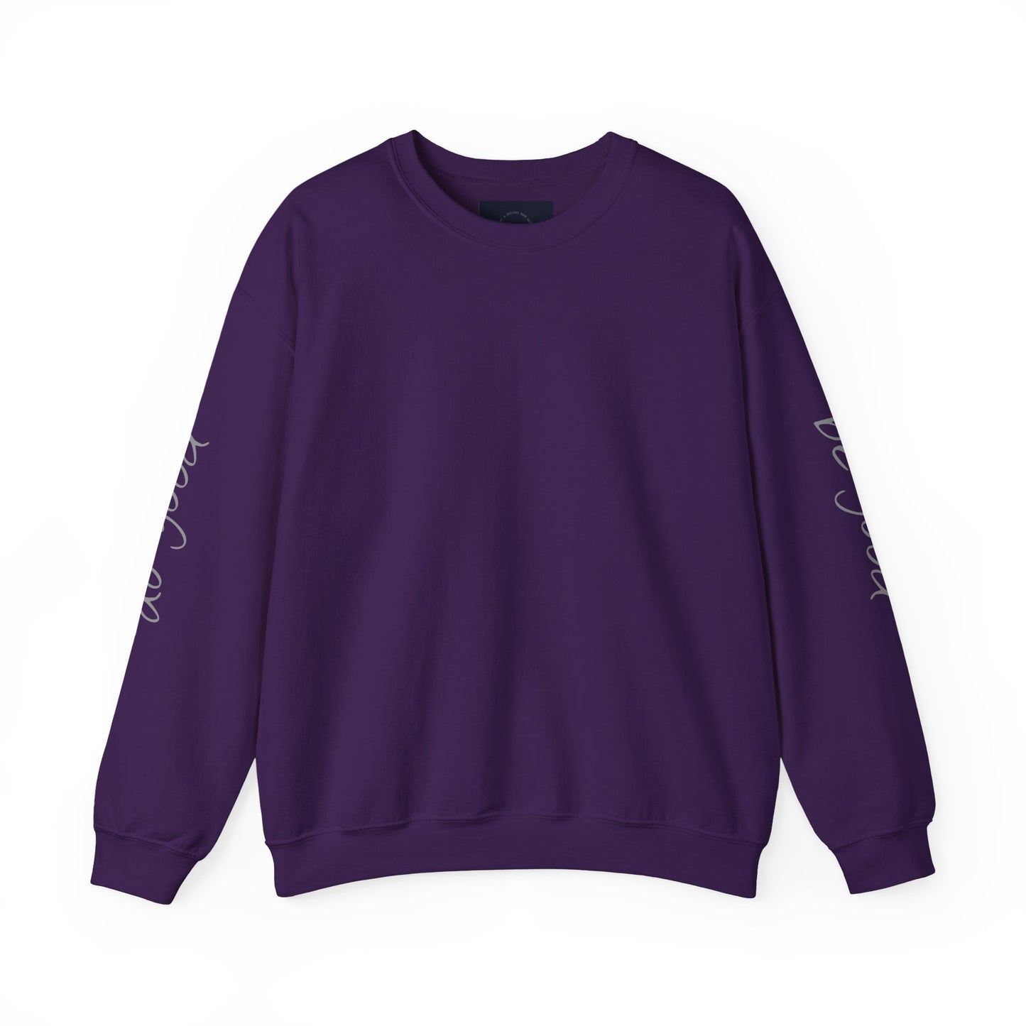 Purple crewneck sweatshirt with "be good, do good" text on sleeves