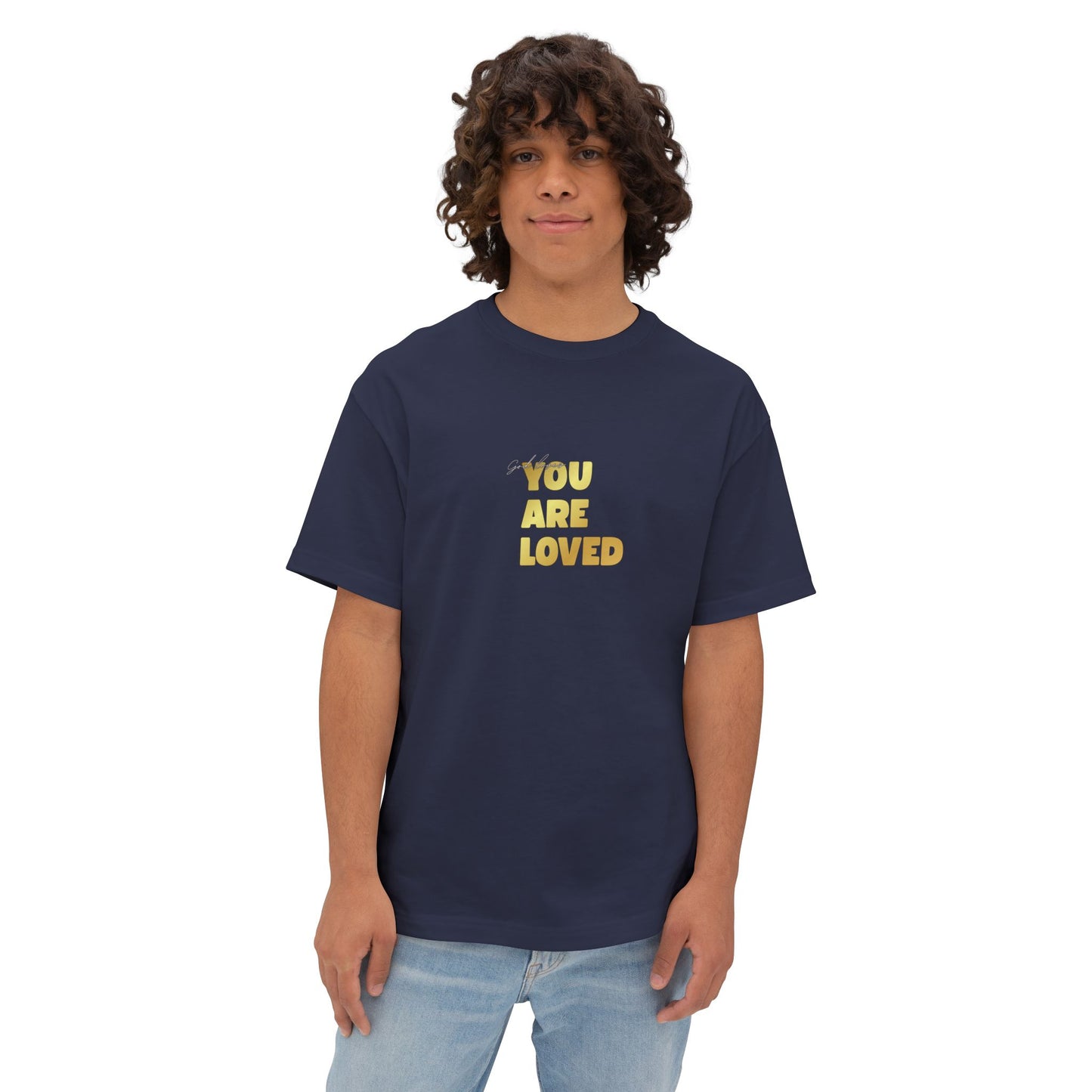 Man wearing navy oversized boxy t-shirt adorned with 'You Are Loved' text in gold on chest.