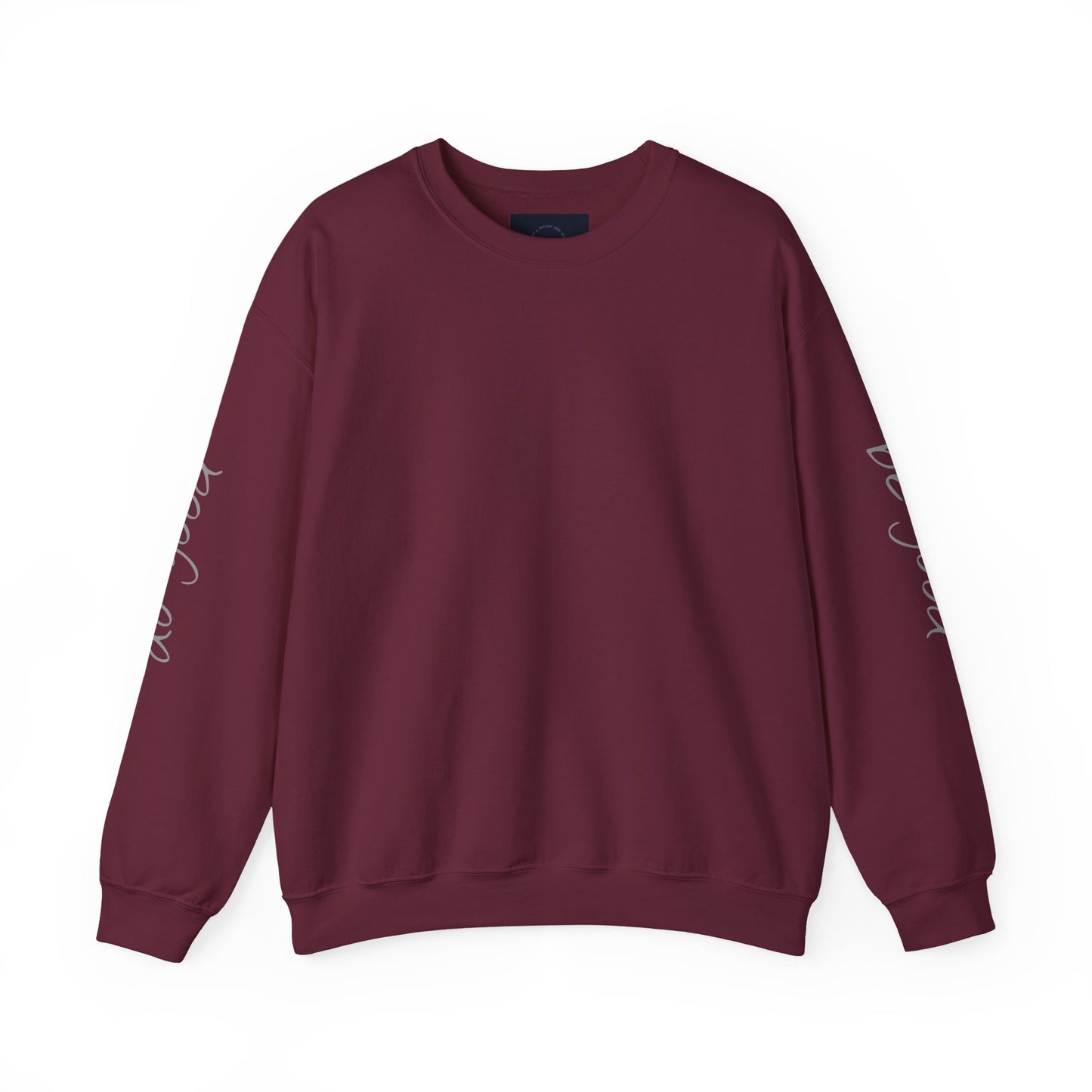 Maroon crewneck sweatshirt with "be good, do good" text on sleeves