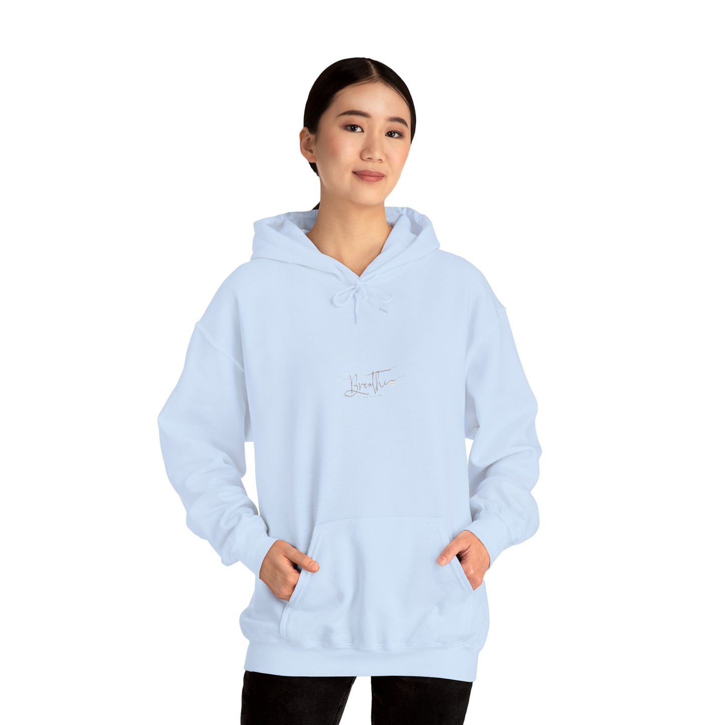 Woman wearing light blue hoodie with 'Breathe' on chest - front view