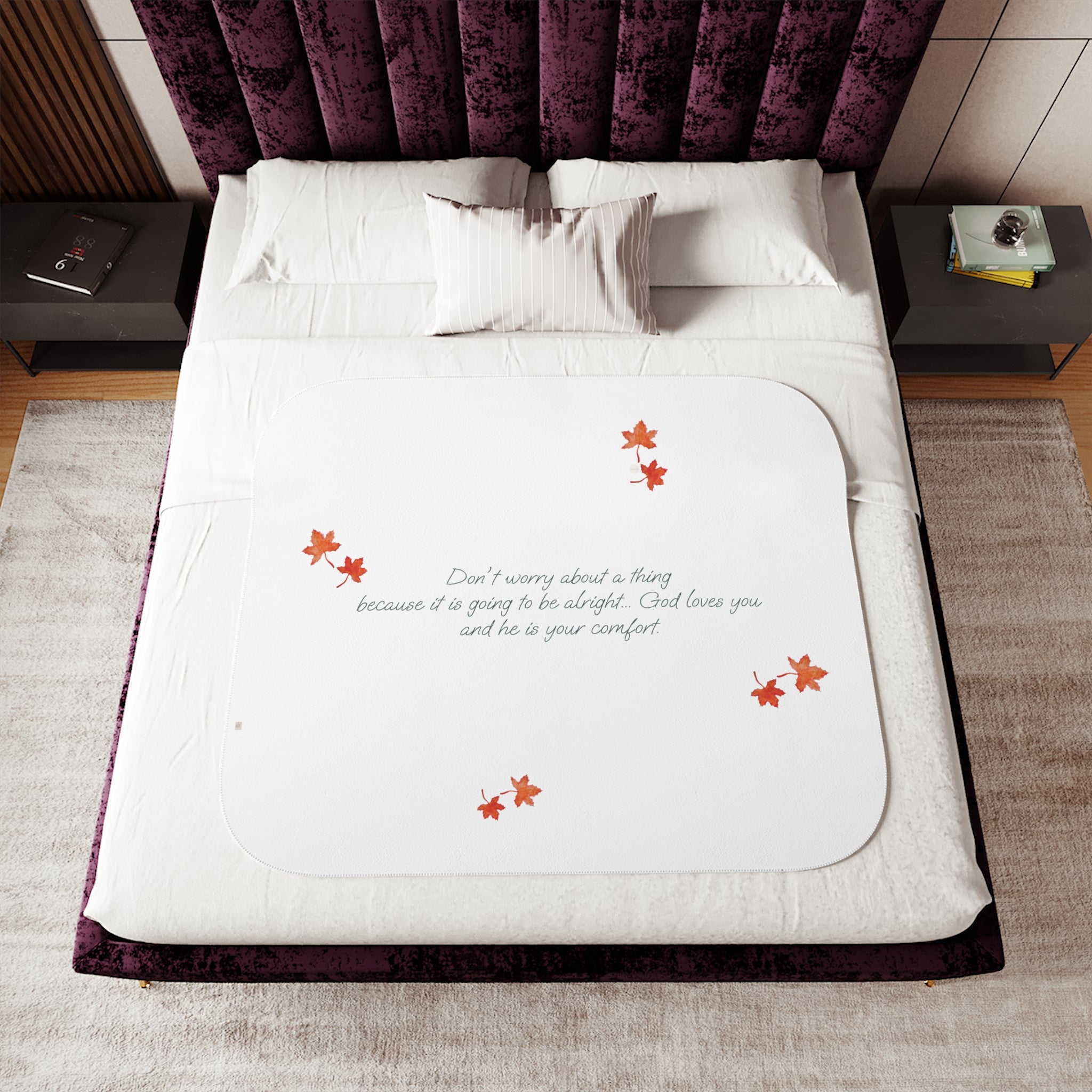 White 50"x60" blanket with inspirational text, maple leaves pattern and eKuumeArt logo, displayed on a bed in a bedroom setting.