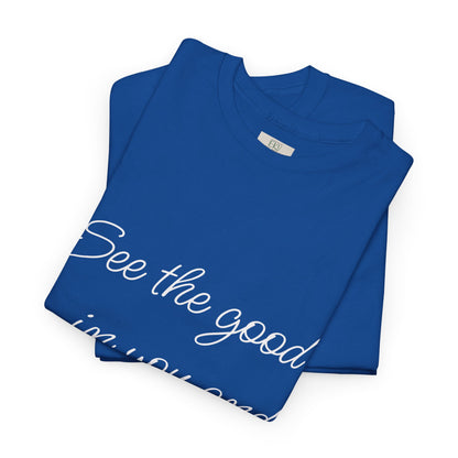 Folded royal blue heavy cotton t-shirt with ‘See the good…’ motivational quote text and eKuumeArt’s neck label.