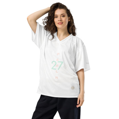 Woman wearing white mesh football jersey with 'Psalm 27' and eKuumeArt logo on torso.