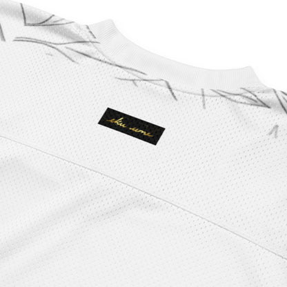 White mesh football jersey, closeup of eKuumeArt label – back view.