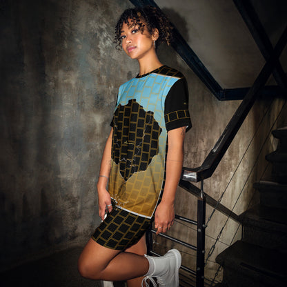 Woman wearing t-shirt dress with Afro Nature art, inspirational text, eKuumeArt logo and geometric design on it – in a dark staircase setting.