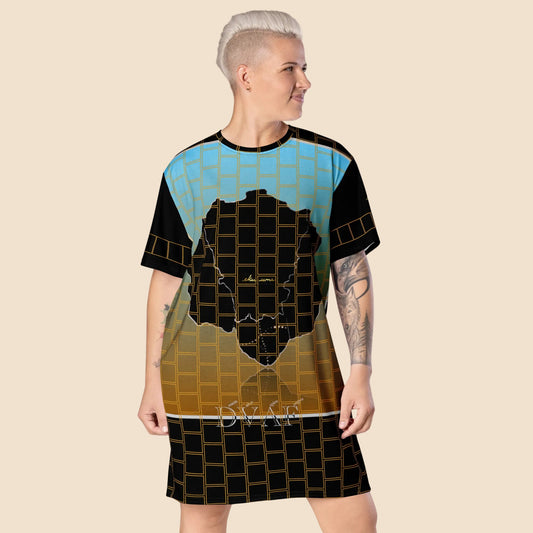 Woman wearing t-shirt dress with Afro Nature art and inspirational text, eKuumeArt logo and geometric design on front and sleeves.