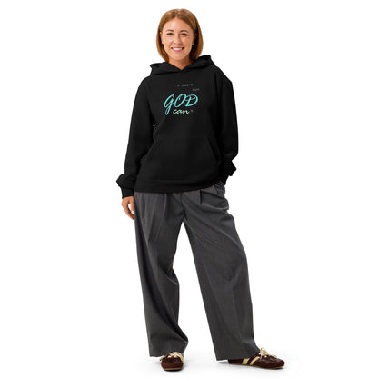 Woman wearing black 'I can't but God can' hoodie – front view.