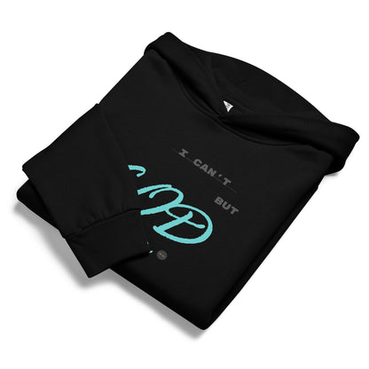 Black hoodie, folded displaying 'I can't but God can' text and eKuumeArt logo on chest – one sleeve fold covering part of text.