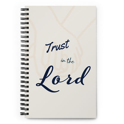 Spiral journal/notebook adorned with 'Trust in the Lord' text on the cover.