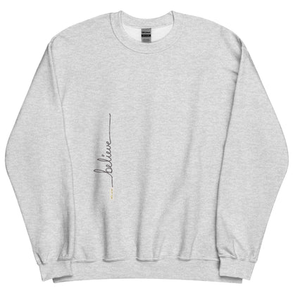 Ash sweater adorned with 'Believe' handwritten text and eKuumeArt logo on torso.
