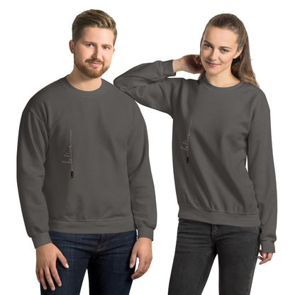 Man and woman wearing charcoal sweaters with 'Believe' handwritten text and eKuumeArt logo on torso – front view.
