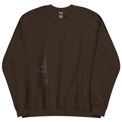 Dark Chocolate sweater adorned with 'Believe' handwritten text and eKuumeArt logo on torso.
