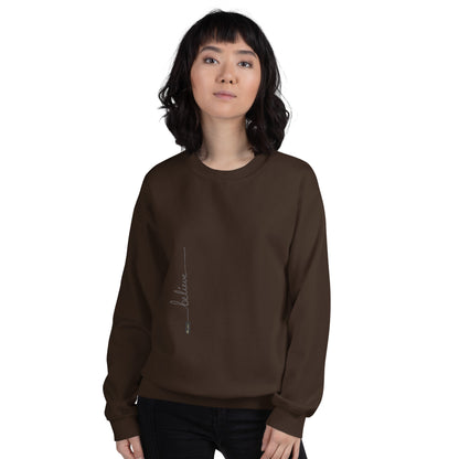 Woman wearing dark chocolate sweater with 'Believe' handwritten text and eKuumeArt logo on torso – front view.