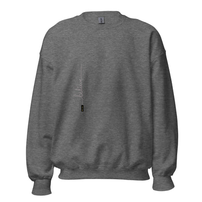 Graphite Heather sweater adorned with 'Believe' handwritten text and eKuumeArt logo on torso.
