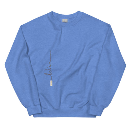 Heather Deep Royal sweater adorned with 'Believe' handwritten text and eKuumeArt logo on torso.