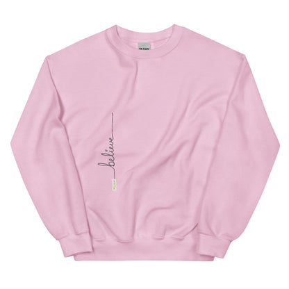 Light Pink sweater adorned with 'Believe' handwritten text and eKuumeArt logo on torso.