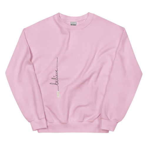 Light Pink crew neck sweater adorned with 'Believe' handwritten text and eKuumeArt logo on torso.