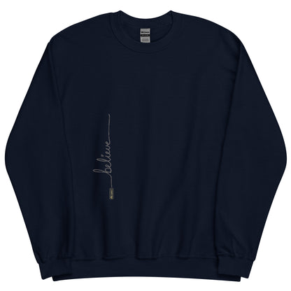 Navy sweater adorned with 'Believe' handwritten text and eKuumeArt logo on torso.