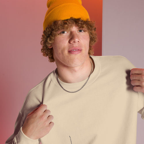 Guy wearing a sand crew neck sweatshirt by eKuumeArt – close up view.
