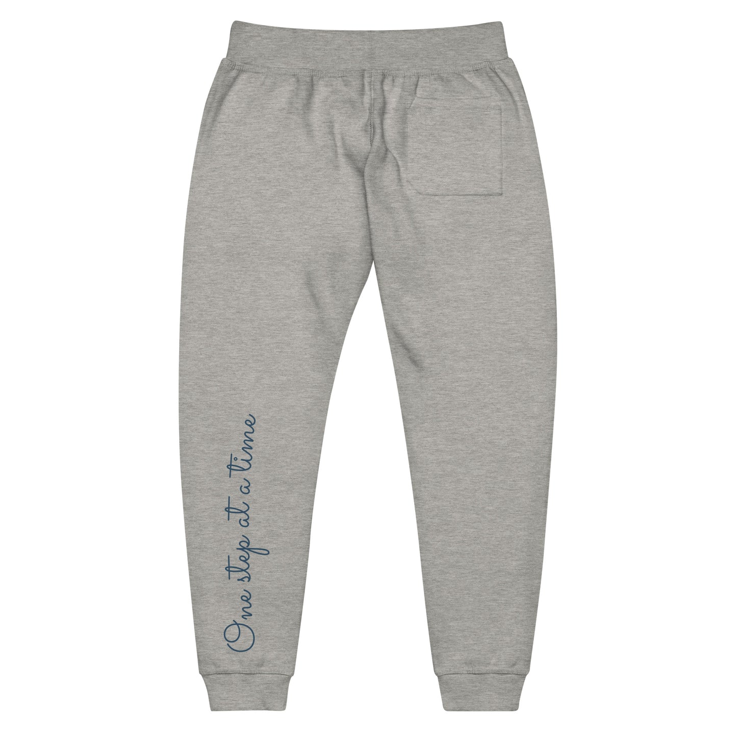 Carbon grey sweatpants adorned with 'One step at a time' text on back left leg.