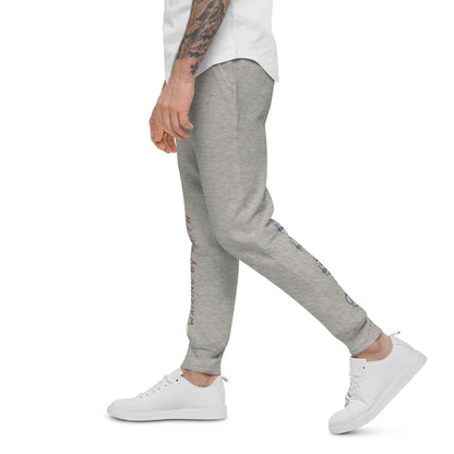 Person wearing carbon grey sweatpants with glimpses of faith-inspired texts on front right leg and back left leg – side view.