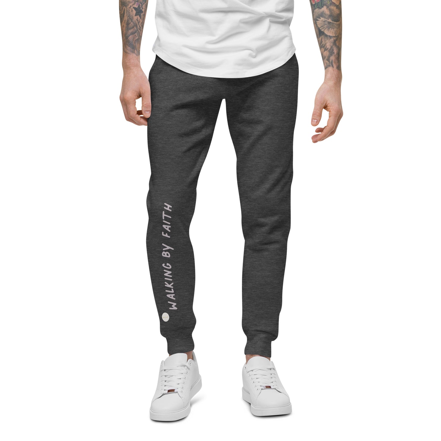 Person wearing charcoal heather sweatpants with 'Walking by faith' text and eKuumeArt logo on front right leg – front view.