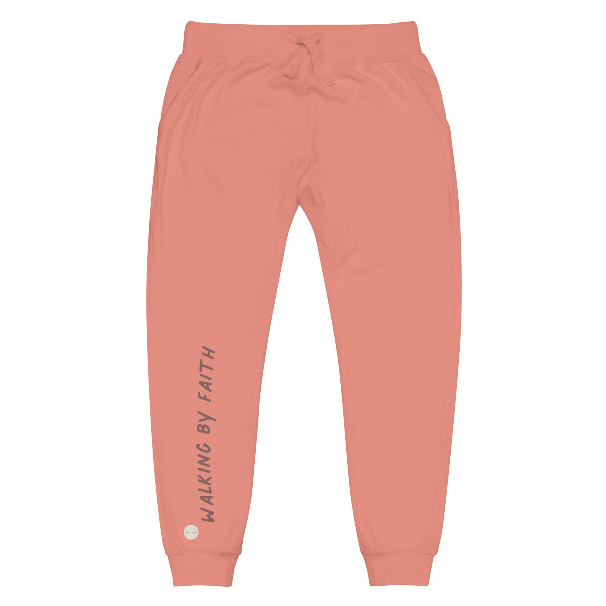 Dusty rose sweatpants adorned with 'Walking by faith' text and eKuumeArt logo on front right leg.