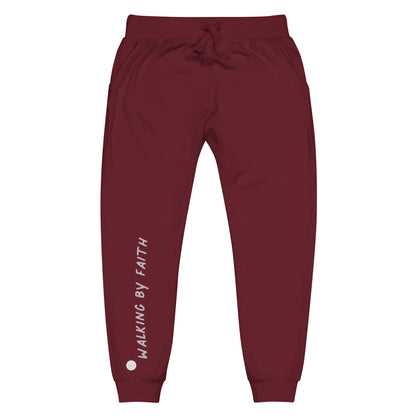 Maroon sweatpants adorned with 'Walking by faith' text and eKuumeArt logo on front right leg.