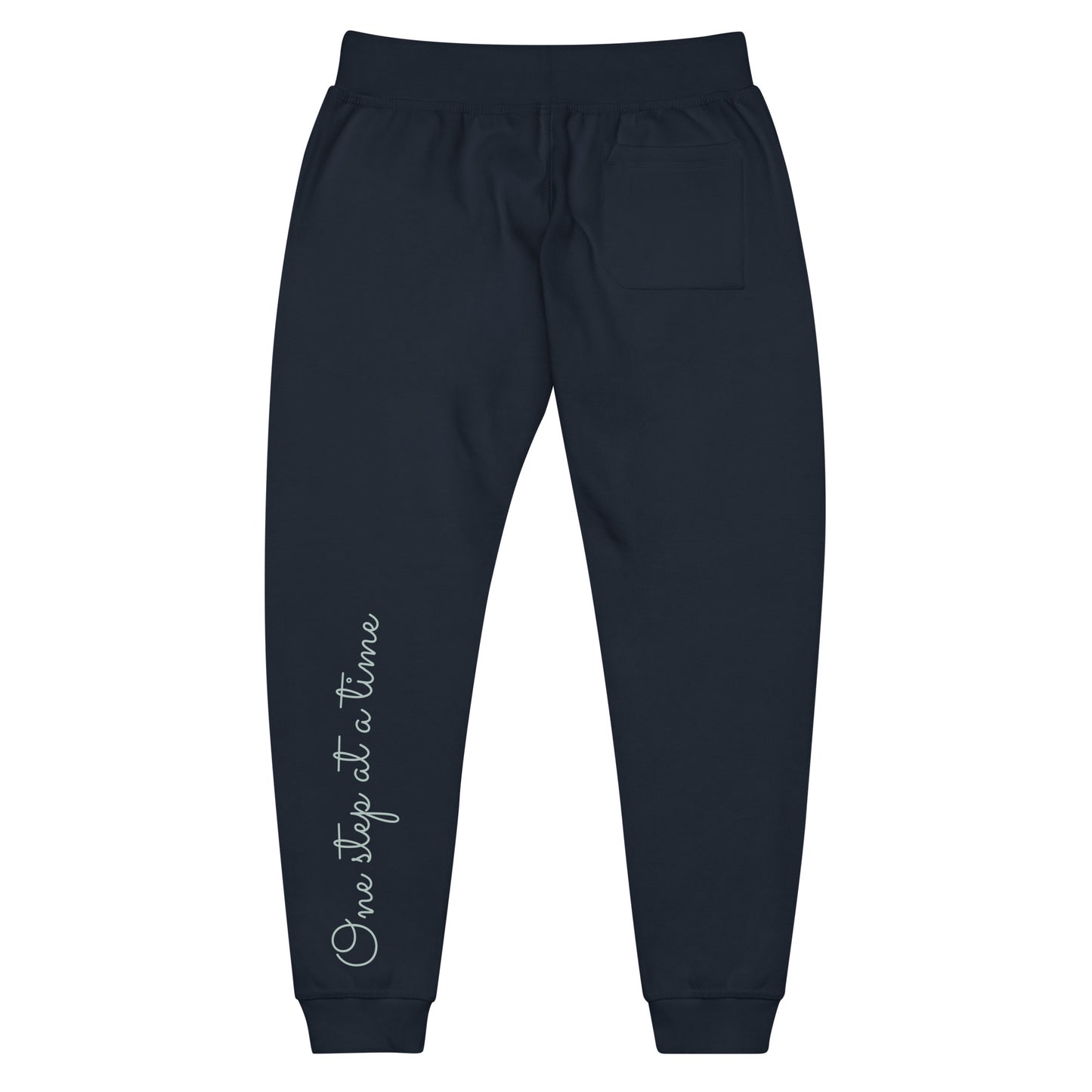 Navy Blazer sweatpants adorned with 'One step at a time' text on back left leg.