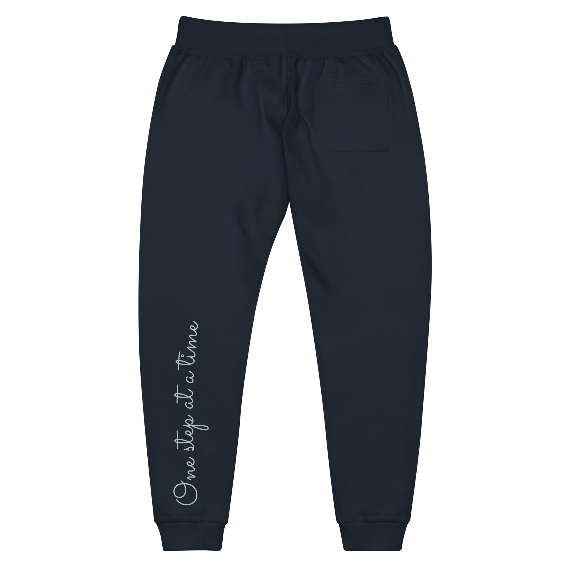 Navy Blazer sweatpants adorned with 'One step at a time' text on back left leg.