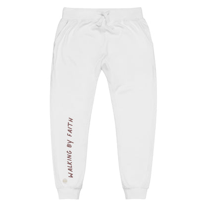 White sweatpants adorned with 'Walking by faith' text and eKuumeArt logo on front right leg.