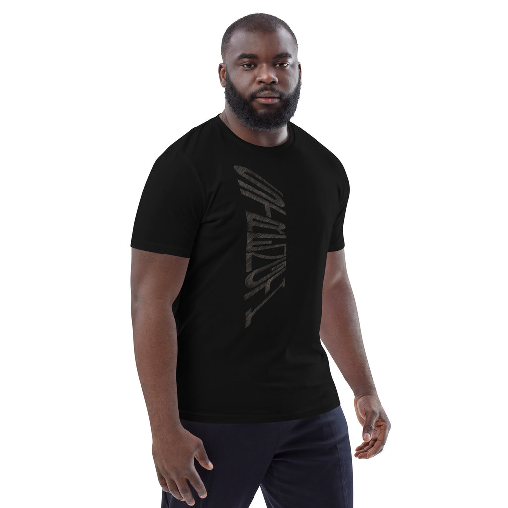 Man wearing black organic cotton t-shirt with hand-drawn 'Strength' text – angled view | eKuumeArt.