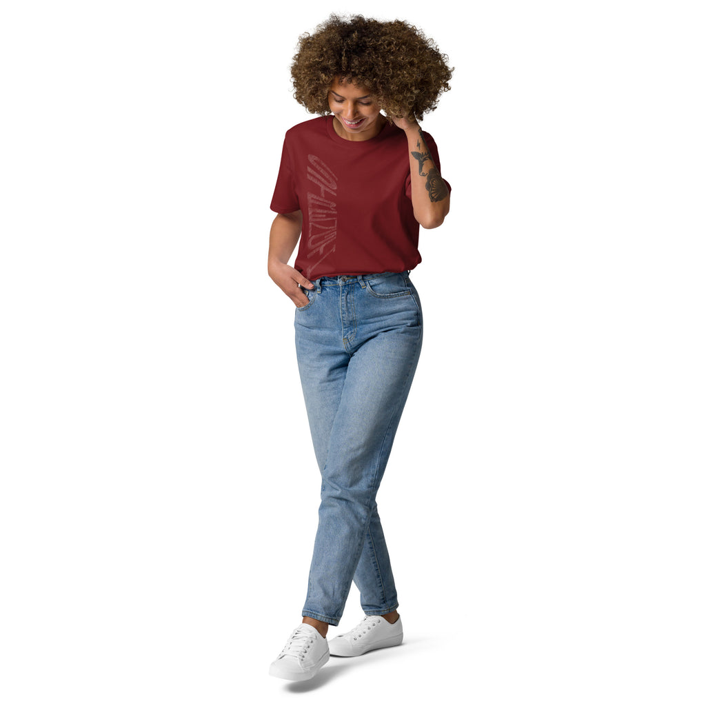 Lady wearing burgundy organic cotton t-shirt with hand-drawn 'Strength' text and blue jeans | eKuumeArt.