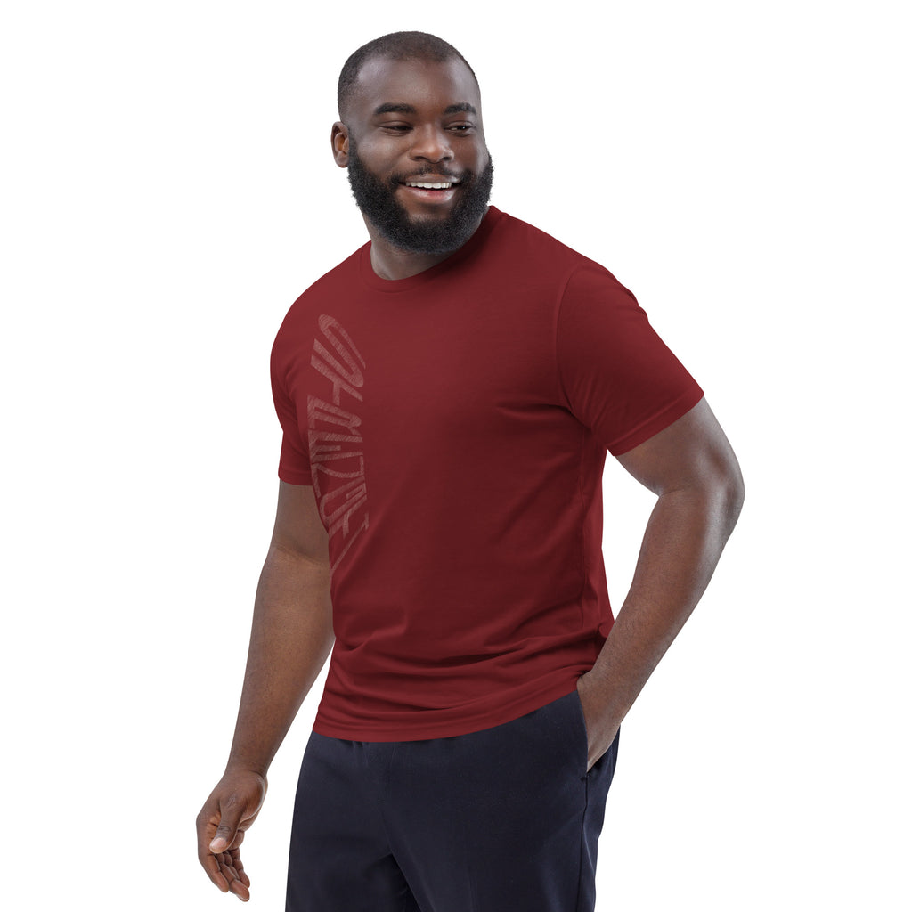 Man wearing burgundy organic cotton t-shirt with hand-drawn 'Strength' text | eKuumeArt.