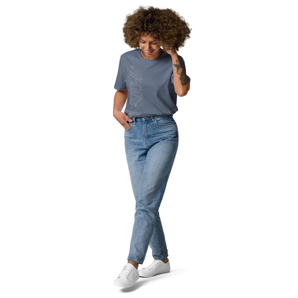 Lady wearing dark heather blue organic cotton t-shirt with hand-drawn 'Strength' text and blue jeans | eKuumeArt.