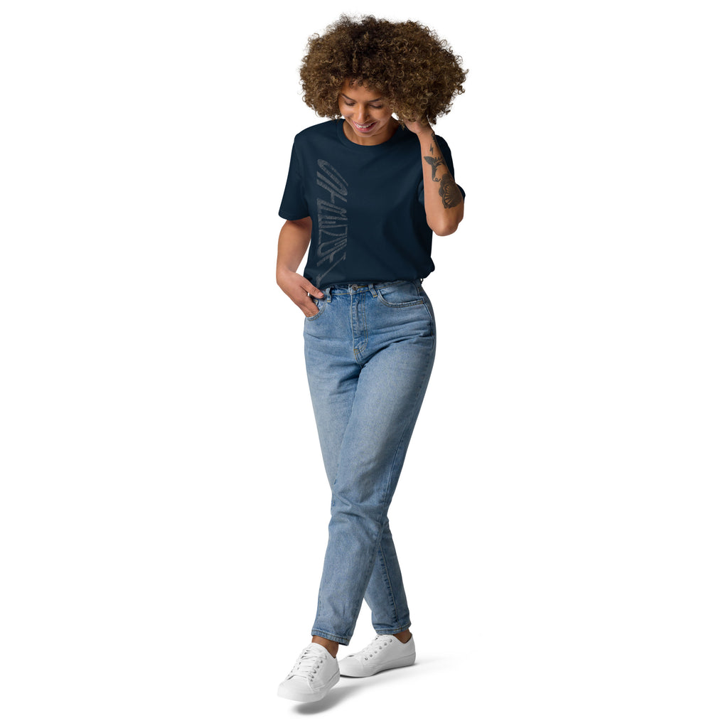 Lady wearing French navy organic cotton t-shirt with hand-drawn 'Strength' text and blue jeans | eKuumeArt.