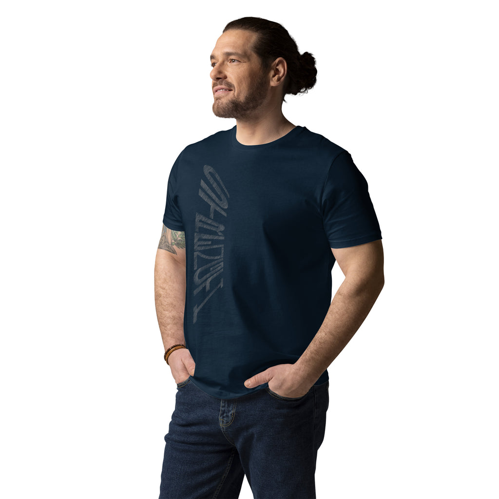Guy wearing French navy organic cotton t-shirt with hand-drawn 'Strength' text – angled view | eKuumeArt.