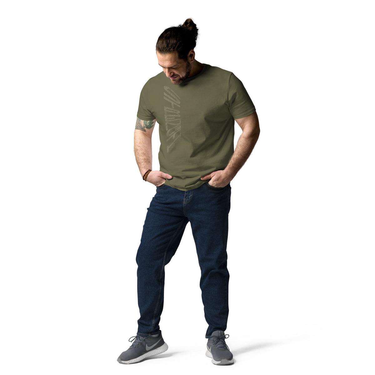 Man wearing khaki green organic cotton t-shirt with hand-drawn 'Strength' text and dark blue jeans | eKuumeArt.