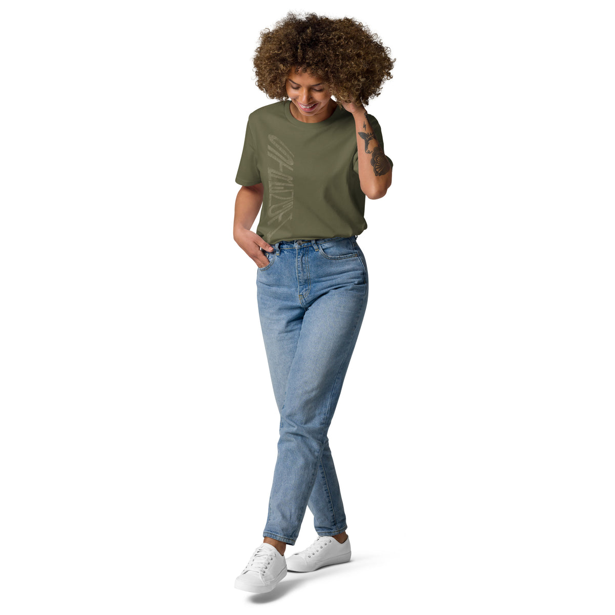 Lady wearing khaki green organic cotton t-shirt with hand-drawn 'Strength' text and blue jeans | eKuumeArt.