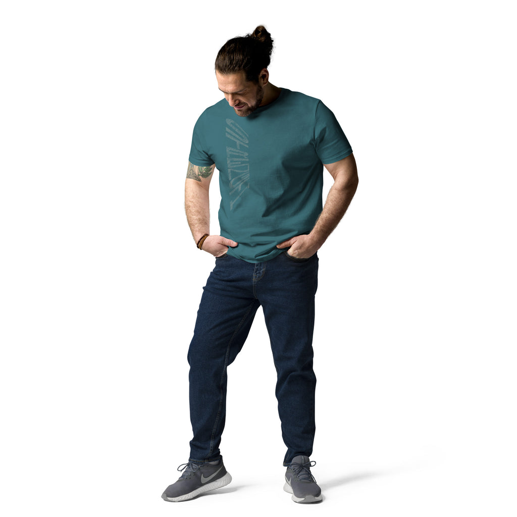 Man wearing stargazer blue organic cotton t-shirt with hand-drawn 'Strength' text and dark blue jeans | eKuumeArt.